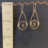 small gold spirals with silver weaving
