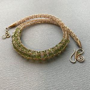 woven gold necklace with green peridot nuggets